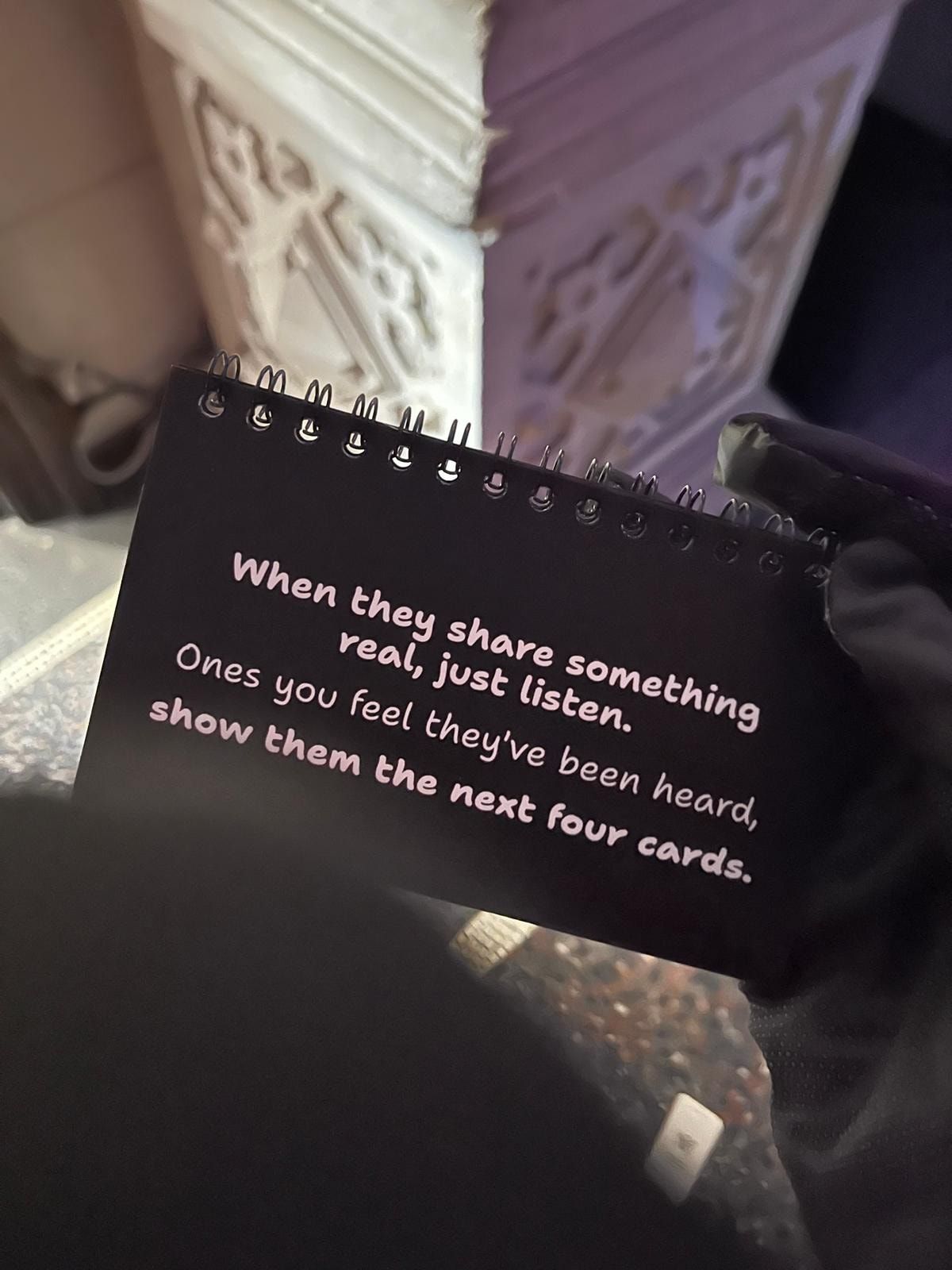 A card in the booklet reading: When they share something real, just listen. Once you feel they've been heard, show them the next four cards