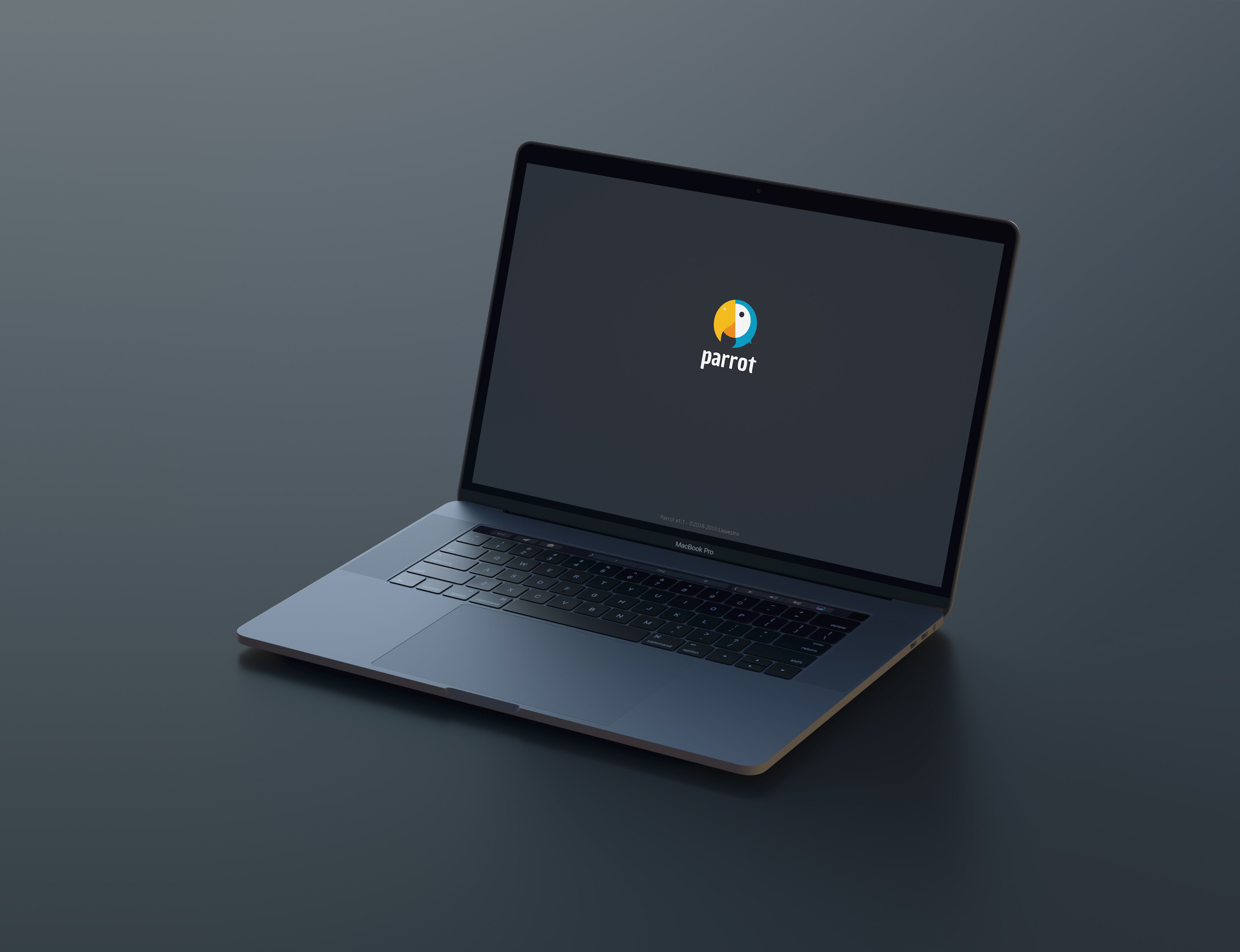 A laptop on a dark surface showing the Parrot CMS logo
